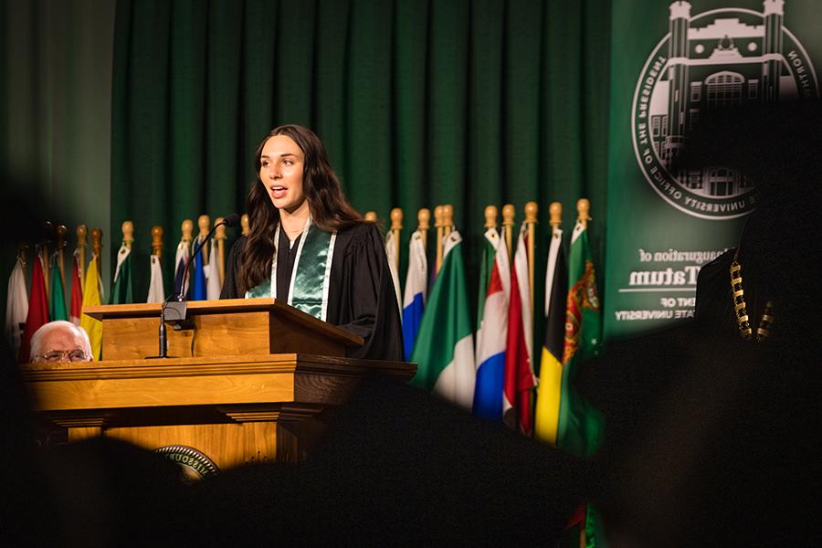 学生参议院 President 和 Student Regent Elizabeth Motazedi delivered greetings to Northwest President Dr. 兰斯·泰特姆. (Photo by Lauren Adams/<a href='http://myce.ospifse.net'>网上赌博网站十大排行</a>)